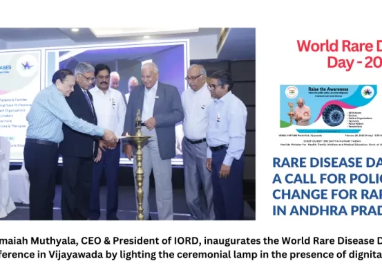 Prof. Ramaiah Muthyala, CEO & President of IORD, inaugurates the World Rare Disease Day 2025 conference in Vijayawada by lighting the ceremonial lamp in the presence of dignitaries.
